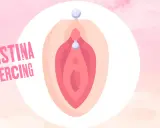 Ilustracja przedstawia Christina piercing, ozdobę w kształcie litery V z dwoma koralikami.